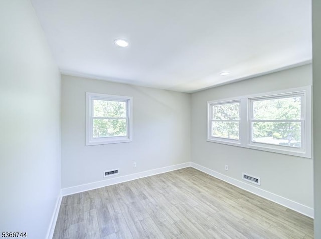 44 Sullivan Way E, Brunswick Twp, NJ 08816 - empty room with plenty of natural light, light wood-style floors, and recessed lighting