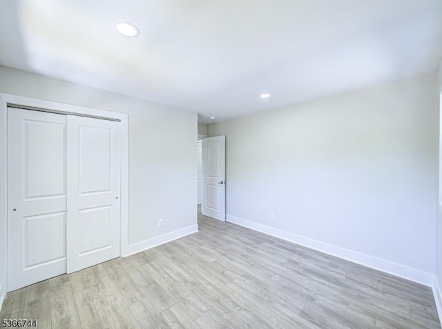 44 Sullivan Way E, Brunswick Twp, NJ 08816 - unfurnished bedroom featuring light wood finished floors, a closet, and recessed lighting