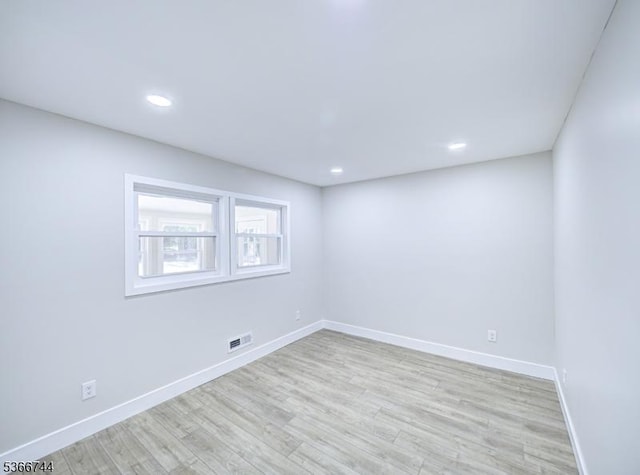 44 Sullivan Way E, Brunswick Twp, NJ 08816 - empty room with light wood finished floors and recessed lighting