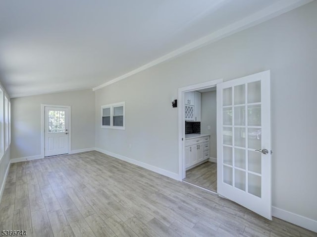 44 Sullivan Way E, Brunswick Twp, NJ 08816 - spare room with light wood finished floors, lofted ceiling, and french doors