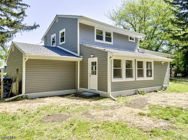 44 Sullivan Way E, Brunswick Twp, NJ 08816 - rear view of house featuring roof with shingles