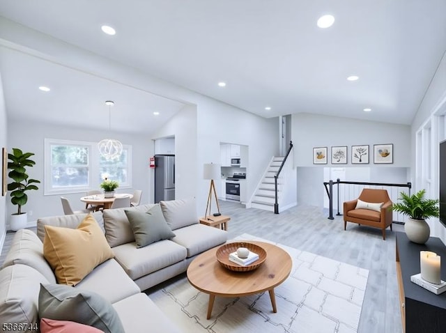 44 Sullivan Way E, Brunswick Twp, NJ 08816 - living room featuring lofted ceiling, recessed lighting, light wood-style floors, and stairs