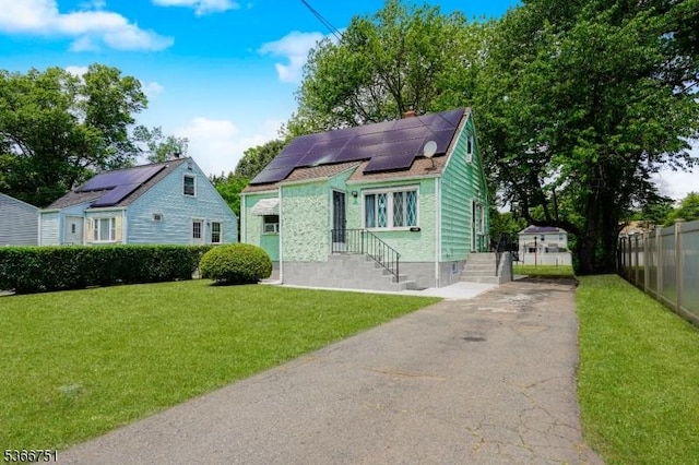139 Churchill Ave, Franklin Twp, NJ 08873 - bungalow featuring driveway, roof mounted solar panels, and a shingled roof