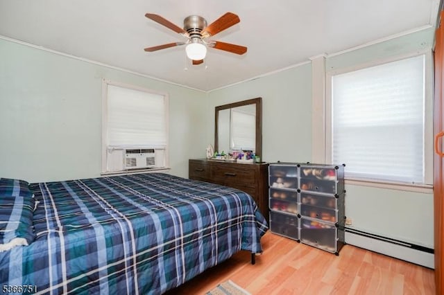 139 Churchill Ave, Franklin Twp, NJ 08873 - bedroom with a baseboard heating unit, wood finished floors, ornamental molding, a ceiling fan, and cooling unit