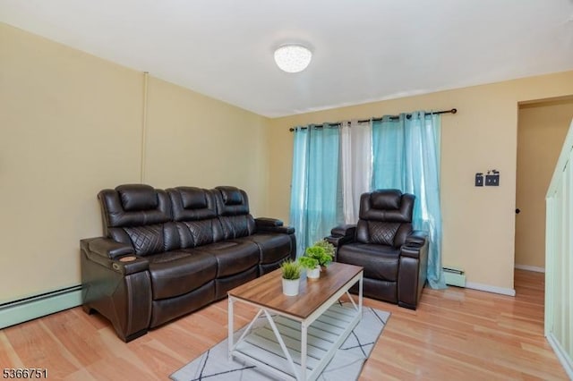 139 Churchill Ave, Franklin Twp, NJ 08873 - living area featuring a baseboard heating unit and light wood-style floors