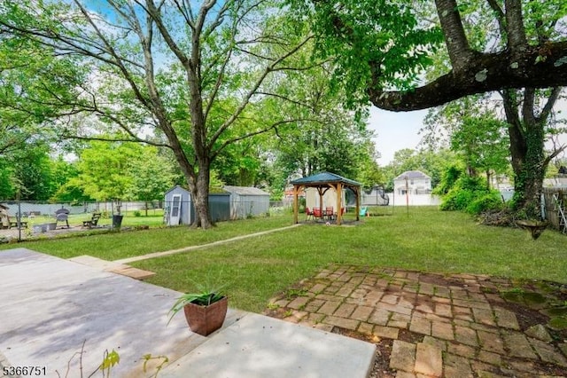 139 Churchill Ave, Franklin Twp, NJ 08873 - fenced backyard featuring a gazebo, a patio area, and a storage unit