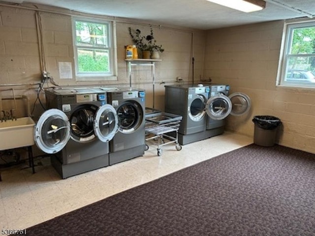 48-50 Elm St Unit B1, Morristown Town, NJ 07960 - communal laundry room featuring independent washer and dryer, concrete block wall, and tile patterned floors