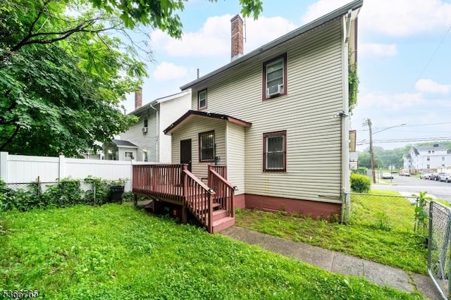 129 Ball St, Irvington Twp, NJ 07111 - rear view of property featuring a chimney and a wooden deck