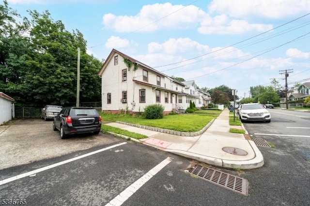 129 Ball St, Irvington Twp, NJ 07111 - view of front of house with uncovered parking and a front lawn