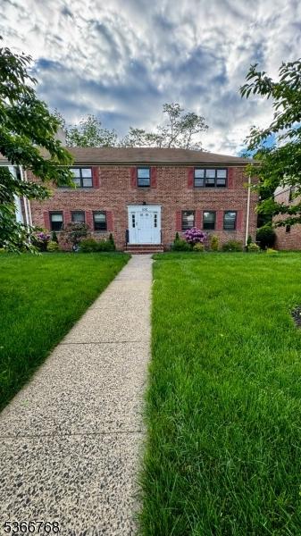 53 Sandra Cir Unit 4, Westfield Town, NJ 07090 - view of front of house featuring a front lawn and brick siding