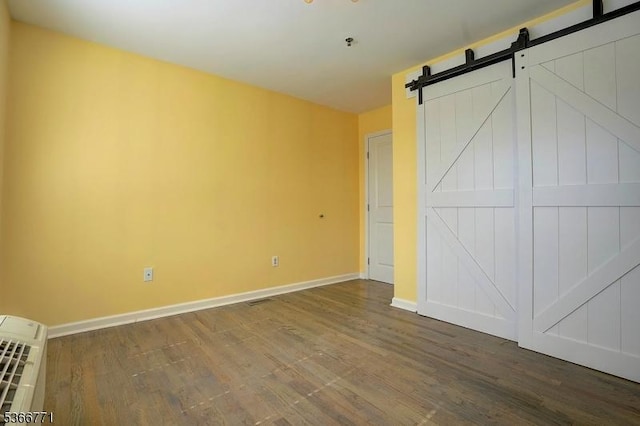 54 Polk Unit P3, Newark City, NJ 07105 - unfurnished bedroom with wood finished floors and a barn door