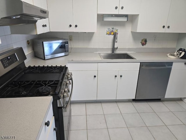 54 Polk Unit P3, Newark City, NJ 07105 - kitchen featuring stainless steel appliances, range hood, white cabinets, and light countertops
