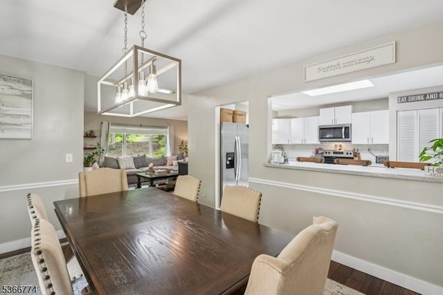 159 Kings Hwy, Washington Twp, NJ 07853 - dining area with dark wood-style floors and a chandelier