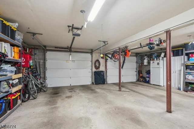 159 Kings Hwy, Washington Twp, NJ 07853 - garage with freestanding refrigerator and a garage door opener
