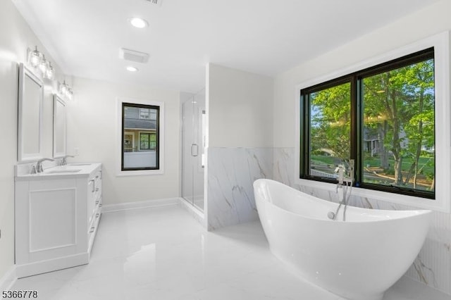 150 Parsippany Blvd, Parsippany-Troy Hills Twp, NJ 07005 - full bathroom featuring marble tiled flooring, vanity, a freestanding bath, a stall shower, and recessed lighting
