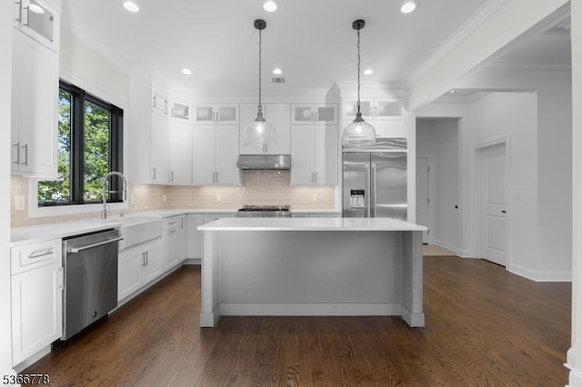 150 Parsippany Blvd, Parsippany-Troy Hills Twp, NJ 07005 - kitchen featuring appliances with stainless steel finishes, a center island, light countertops, tasteful backsplash, and recessed lighting