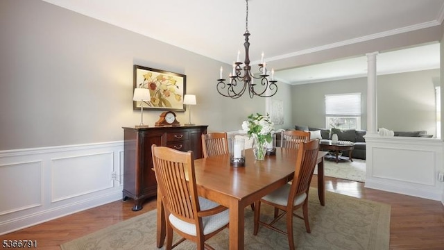 31 Burniston Ct, Hillsborough Twp, NJ 08844 - dining area featuring wood finished floors, a decorative wall, crown molding, a wainscoted wall, and a chandelier
