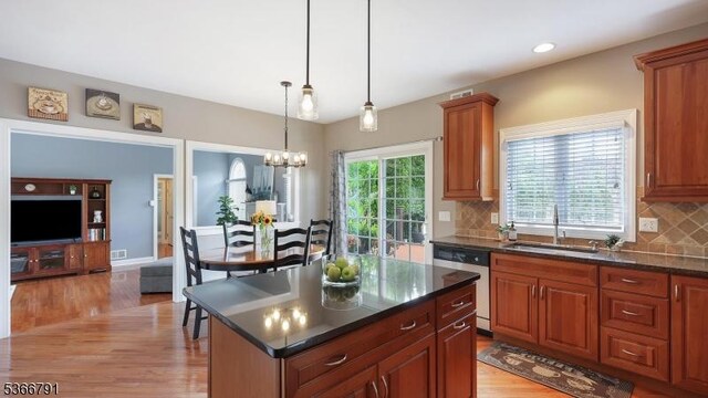 31 Burniston Ct, Hillsborough Twp, NJ 08844 - kitchen with stainless steel dishwasher, healthy amount of natural light, light wood-style floors, a chandelier, and recessed lighting
