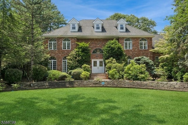 17 N Ridge Rd, Denville Twp, NJ 07834 - colonial inspired home featuring brick siding, a front lawn, and a shingled roof