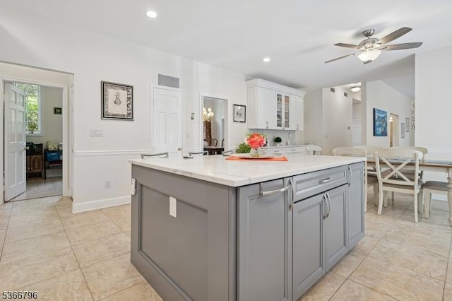 17 N Ridge Rd, Denville Twp, NJ 07834 - kitchen featuring gray cabinetry, white cabinetry, light countertops, a ceiling fan, and a center island