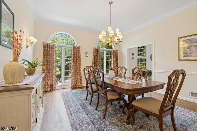 17 N Ridge Rd, Denville Twp, NJ 07834 - dining space featuring crown molding, a chandelier, and light wood-style floors