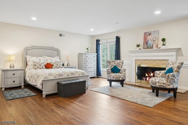 17 N Ridge Rd, Denville Twp, NJ 07834 - bedroom with wood finished floors, a lit fireplace, and recessed lighting