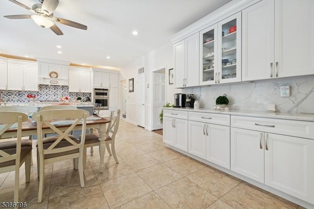 17 N Ridge Rd, Denville Twp, NJ 07834 - kitchen featuring double oven, backsplash, light countertops, glass insert cabinets, and white cabinetry