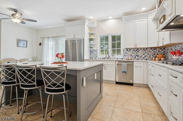 17 N Ridge Rd, Denville Twp, NJ 07834 - kitchen with stainless steel appliances, tasteful backsplash, ceiling fan, a kitchen bar, and recessed lighting
