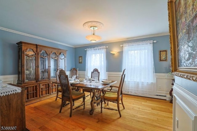 4 Panorama Dr, Vernon Twp, NJ 07461 - dining room featuring wainscoting, light wood-type flooring, ornamental molding, a decorative wall, and a baseboard radiator