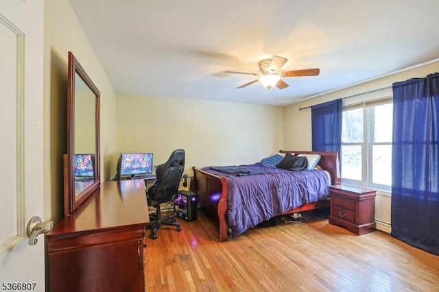 4 Panorama Dr, Vernon Twp, NJ 07461 - bedroom with light wood-style flooring, a ceiling fan, a baseboard heating unit, and a desk