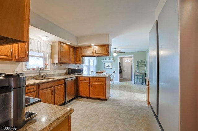 4 Panorama Dr, Vernon Twp, NJ 07461 - kitchen with appliances with stainless steel finishes, brown cabinetry, a peninsula, and a ceiling fan