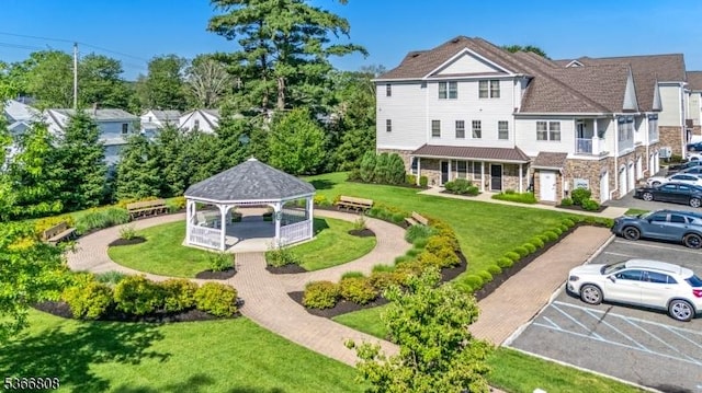 6 Elston Ct, Wanaque Boro, NJ 07420 - back of property with a gazebo, stone siding, uncovered parking, and a lawn