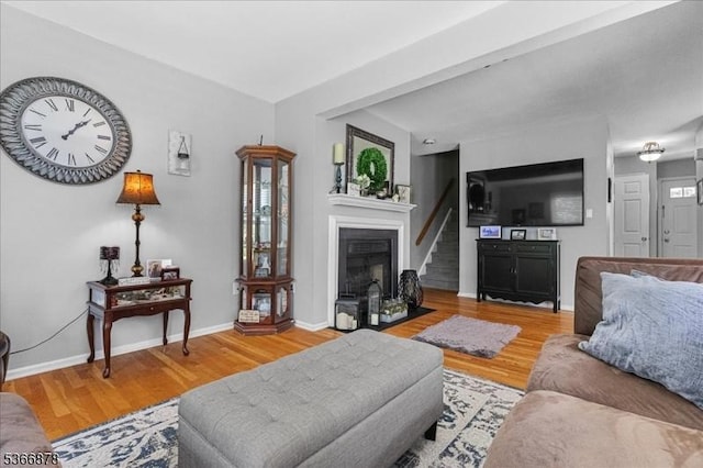 40 Lancelot Dr, Berkeley Heights Twp, NJ 07922 - living area featuring a fireplace, wood finished floors, and stairs