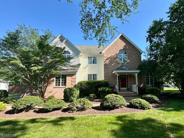 16 Van Deripe Rd, Hillsborough Twp, NJ 08844 - traditional-style house featuring brick siding and a front lawn