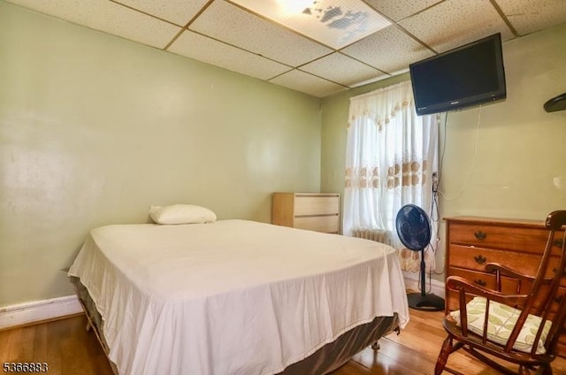 10-12 Medbourne Ave, Irvington Twp, NJ 07111 - bedroom featuring a drop ceiling and wood finished floors