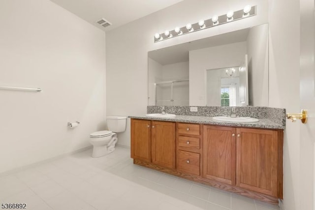 7303 Ravenscroft Rd Unit 7303, Clifton City, NJ 07013 - bathroom featuring double vanity, an enclosed shower, and tile patterned flooring