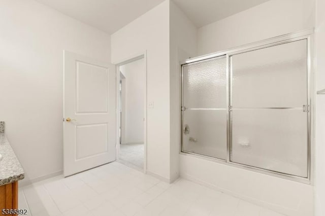 7303 Ravenscroft Rd Unit 7303, Clifton City, NJ 07013 - bathroom with vanity and bath / shower combo with glass door