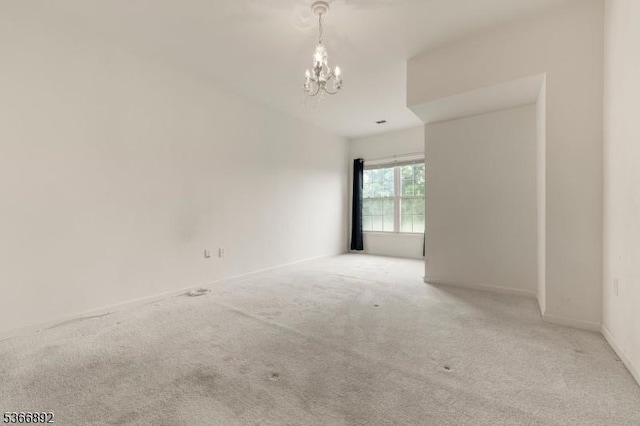 7303 Ravenscroft Rd Unit 7303, Clifton City, NJ 07013 - carpeted spare room featuring a chandelier and baseboards
