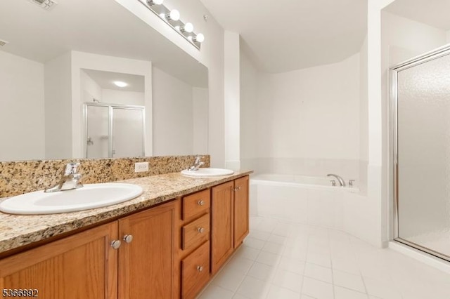 7303 Ravenscroft Rd Unit 7303, Clifton City, NJ 07013 - full bathroom featuring a stall shower, a garden tub, tile patterned flooring, and double vanity