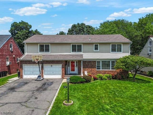 357 Minute Arms Rd, Union Twp, NJ 07083 - view of front of property with a garage, driveway, a front lawn, and brick siding