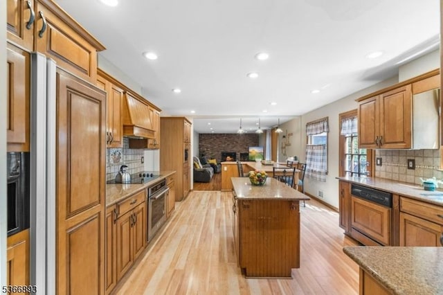 357 Minute Arms Rd, Union Twp, NJ 07083 - kitchen featuring dishwasher, stainless steel oven, a center island, black electric cooktop, and light wood-style flooring