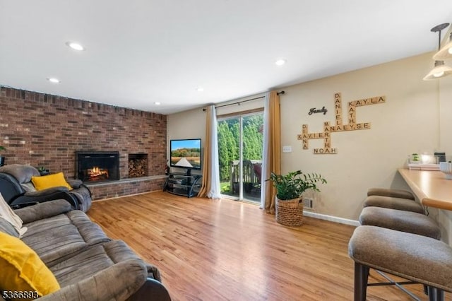 357 Minute Arms Rd, Union Twp, NJ 07083 - living room featuring wood finished floors, recessed lighting, and a brick fireplace