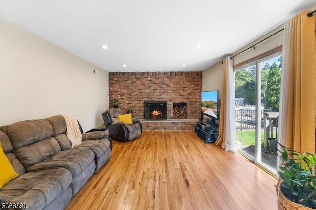 357 Minute Arms Rd, Union Twp, NJ 07083 - living room with light wood-style flooring, a brick fireplace, and recessed lighting
