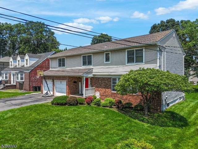 357 Minute Arms Rd, Union Twp, NJ 07083 - view of front of property featuring asphalt driveway, a front lawn, an attached garage, and brick siding