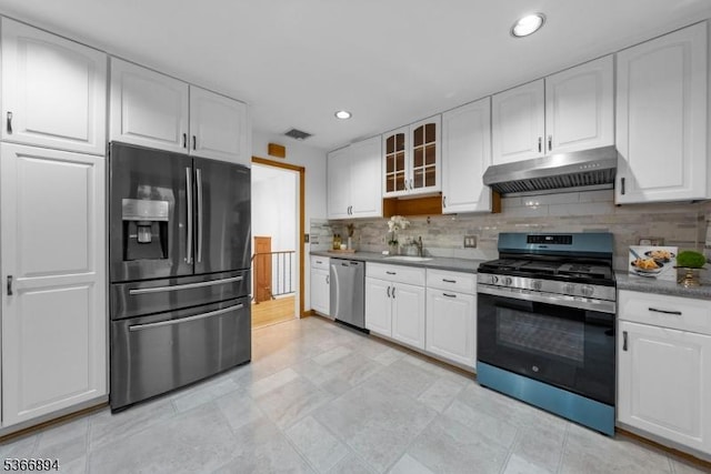 11 Hillcrest Blvd, Warren Twp, NJ 07059 - kitchen featuring appliances with stainless steel finishes, under cabinet range hood, white cabinets, backsplash, and glass insert cabinets