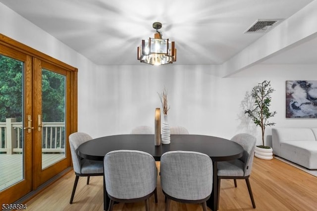 11 Hillcrest Blvd, Warren Twp, NJ 07059 - dining room featuring french doors, a chandelier, and wood finished floors