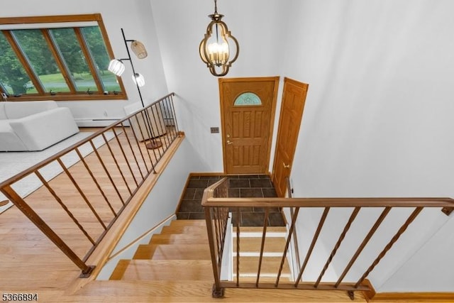 11 Hillcrest Blvd, Warren Twp, NJ 07059 - entryway with a chandelier, a baseboard radiator, and stairway