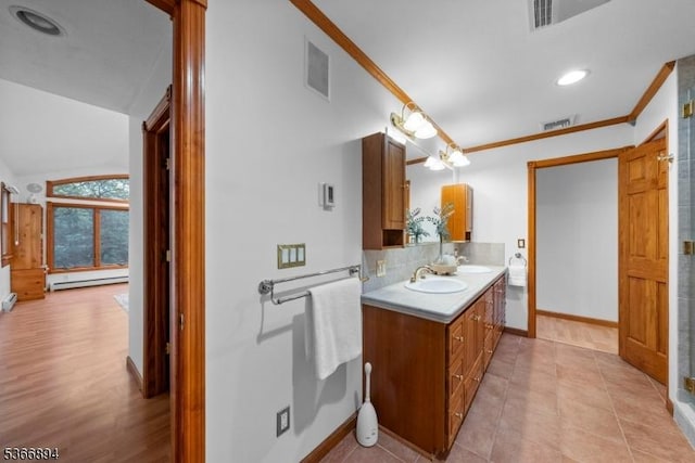 11 Hillcrest Blvd, Warren Twp, NJ 07059 - bathroom with double vanity, tasteful backsplash, baseboard heating, lofted ceiling, and tile patterned floors