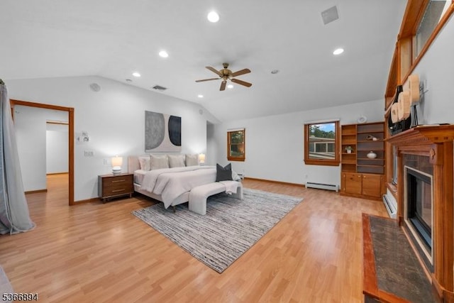 11 Hillcrest Blvd, Warren Twp, NJ 07059 - bedroom featuring vaulted ceiling, a glass covered fireplace, a baseboard radiator, light wood finished floors, and a baseboard heating unit