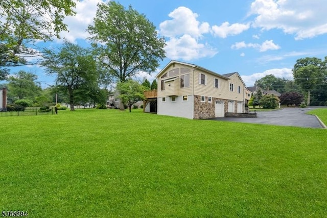 11 Hillcrest Blvd, Warren Twp, NJ 07059 - view of grassy yard featuring a garage and asphalt driveway
